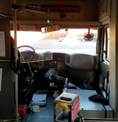 lexan shield replaces curtain in bus