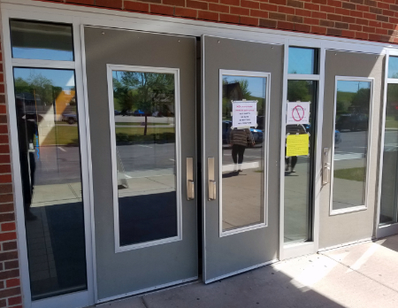 voting doors no covid signs